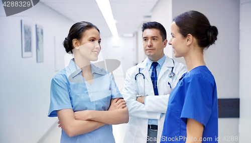 Image of group of medics or doctors talking at hospital