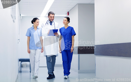 Image of group of medics at hospital with clipboard