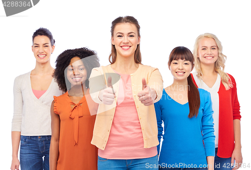 Image of international group of women showing thumbs up