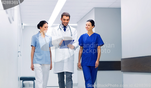 Image of group of medics at hospital with clipboard