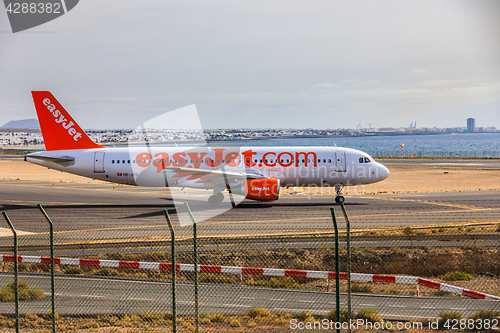 Image of ARECIFE, SPAIN - APRIL, 15 2017: AirBus A320 of easyjet.com read