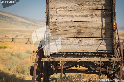 Image of Abstract of Vintage Antique Wood Wagon In Meadow.