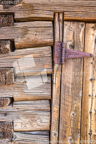 Image of Abstract of Vintage Antique Log Cabin Wall and Door with Hinge.