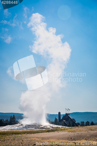 Image of Old Faithful Geyser Erupting at Yellowstone National Park.