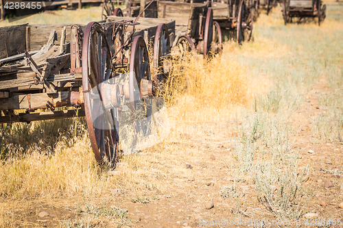 Image of Abstract of Vintage Antique Wood Wagons and Wheels.