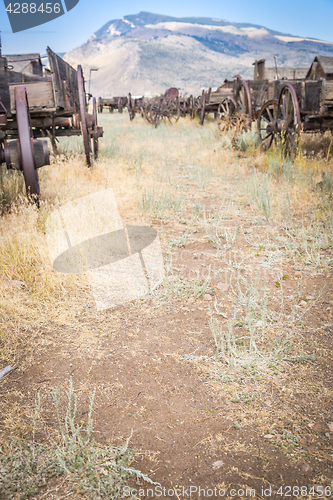 Image of Abstract of Vintage Antique Wood Wagons and Wheels.