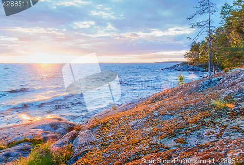 Image of Rocky Coast of Lake At Sunset