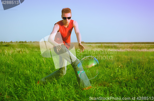 Image of Young Man On Green Meadow