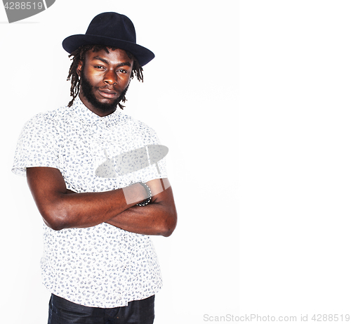 Image of young handsome afro american boy in stylish hipster hat gesturin