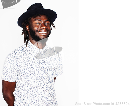 Image of young handsome afro american boy in stylish hipster hat gesturin