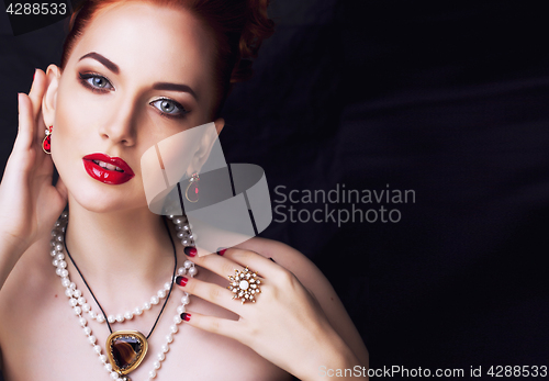 Image of beauty stylish redhead woman with hairstyle and manicure wearing