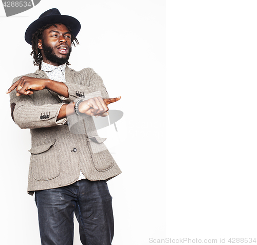 Image of young handsome afro american boy in stylish hipster hat gesturin