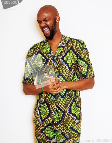 Image of portrait of young handsome african man wearing bright green nati