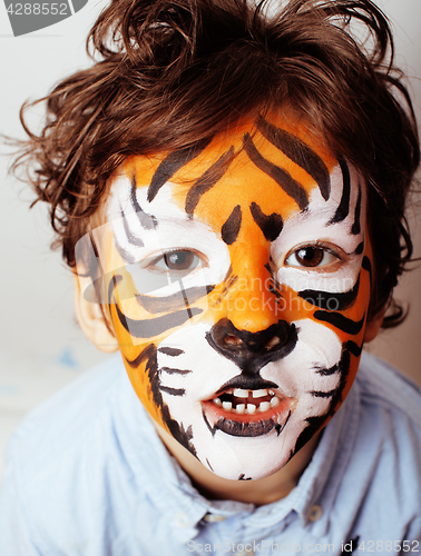 Image of little cute boy with faceart on birthday party close up, little 