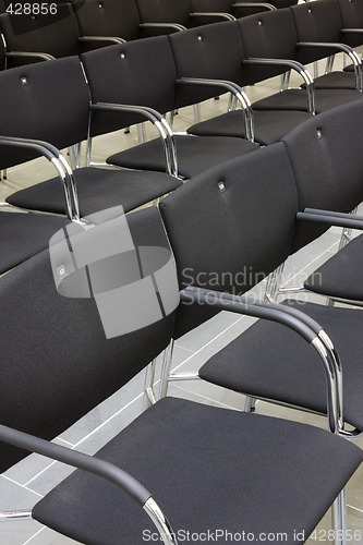 Image of Black chairs in a row