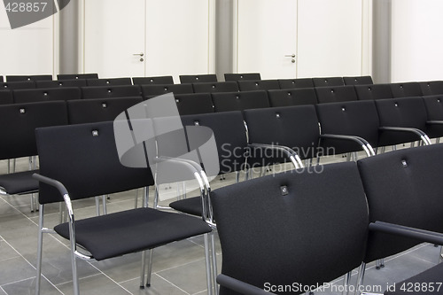 Image of Black chairs in a row