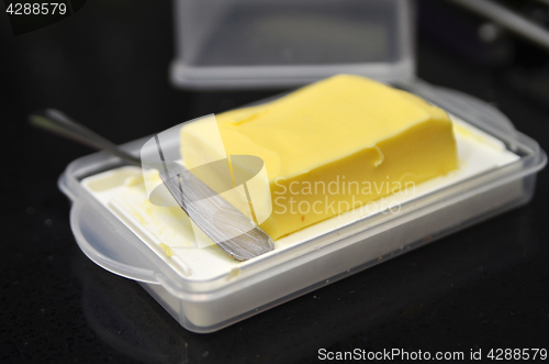 Image of Butter cube on the black table 