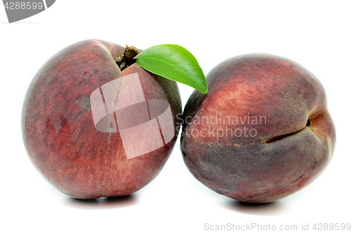 Image of Peach with leaf isolated on white