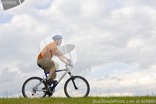 Image of Man riding a mountain bike