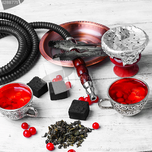 Image of hookah with berries tea