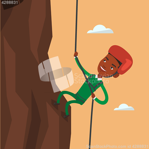 Image of Man climbing in mountains with rope.