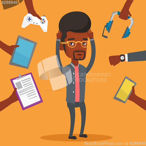 Image of Young man surrounded with his gadgets.
