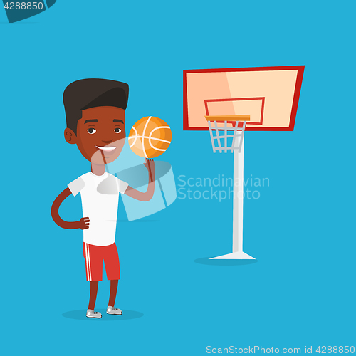 Image of Young basketball player spinning ball.