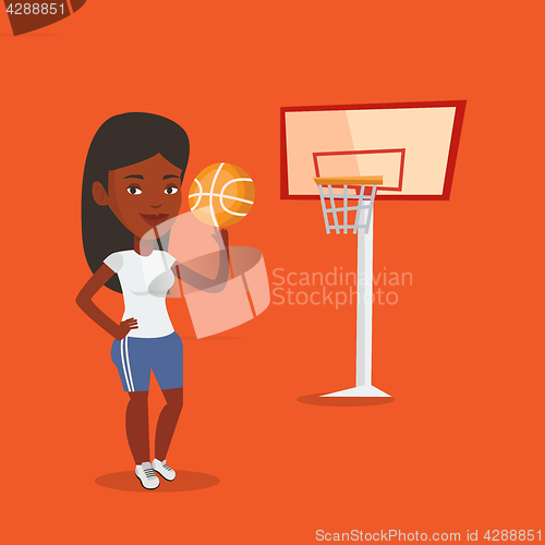 Image of Young basketball player spinning ball.