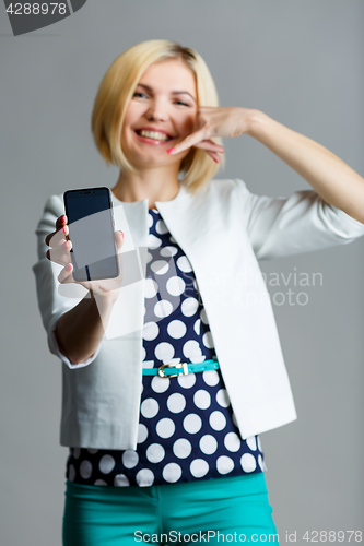 Image of Woman with smartphone in hand