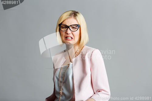 Image of Sad woman in black glasses