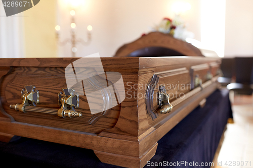 Image of coffin at funeral in church