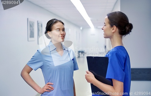 Image of medics, nurses or doctors talking at hospital