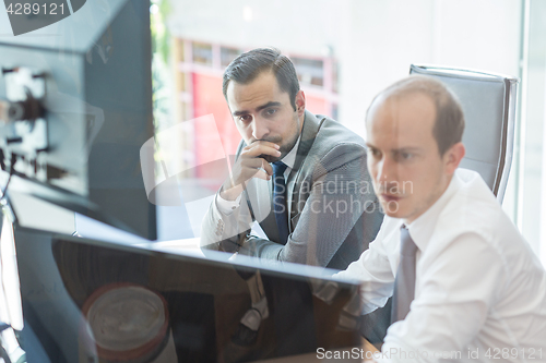 Image of Business team analyzing data at business meeting.