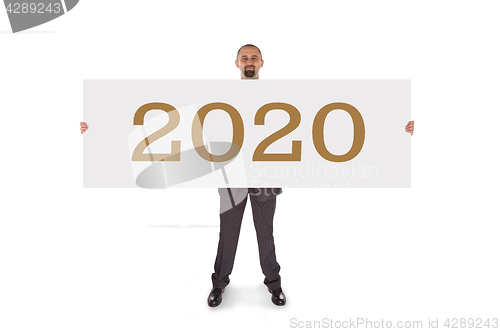 Image of Smiling businessman holding a really big blank card - 2020