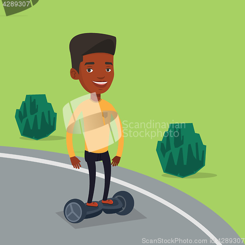 Image of Man riding on self-balancing electric scooter.