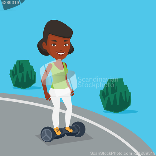 Image of Woman riding on self-balancing electric scooter.