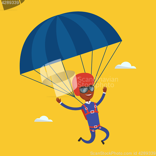 Image of Young happy man flying with parachute.