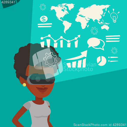 Image of Businesswoman in vr headset analyzing virtual data