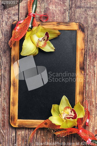 Image of blackboard and flower