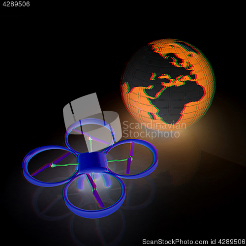 Image of Quadrocopter Drone with Earth Globe and remote controller on a w