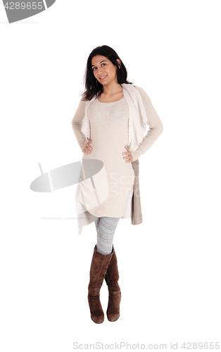 Image of Woman standing in a knitted dress.