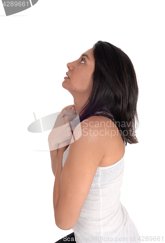 Image of Praying woman looking up.