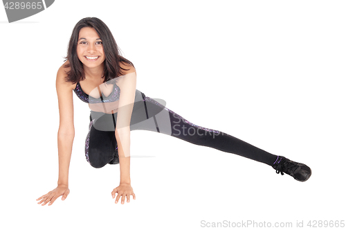 Image of Exercising woman on the floor.