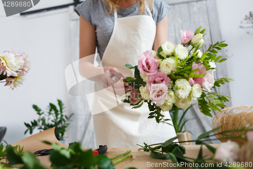 Image of Image of florist making bouquet