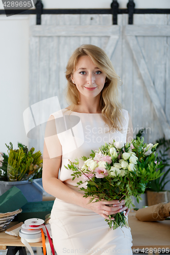 Image of Portrait of woman with bouquet