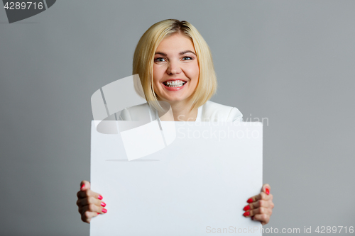 Image of Young woman with blank sheet