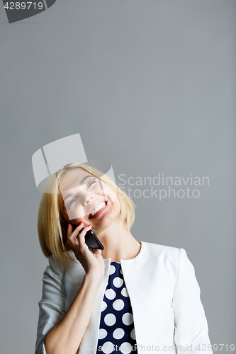 Image of Beautiful girl talking on phone