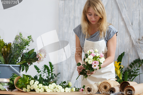 Image of Photo of girl making bouquet