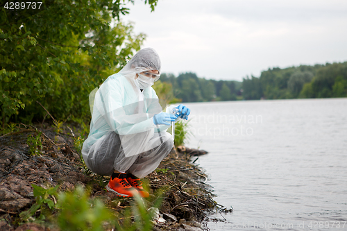 Image of Young environmentalist takes water samples