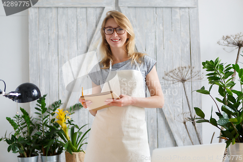 Image of Girl florist on background flower